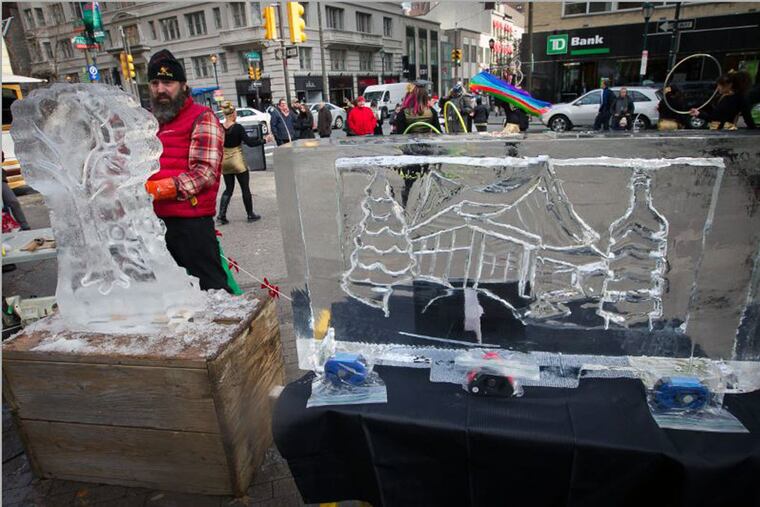 Roger Wing of Roger Wing Sculptures LLC works on an ice sculpture during the kickoff for the Historic Houses of Fairmount Park's annual festivities.