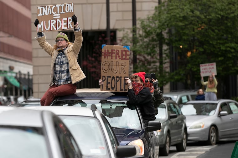 Protesters rally outside of City Hall for the release of inmates amid coronavirus (COVID-19) fears on Friday, April 10, 2020. A new court process this week to has led to the release of hundreds of city jail inmates, but advocates say it's not moving fast enough.