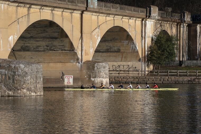 Crews rowing on the Schuylkill earlier this month; it's been that kind of winter. It should resume after a brief cold break this weekend.