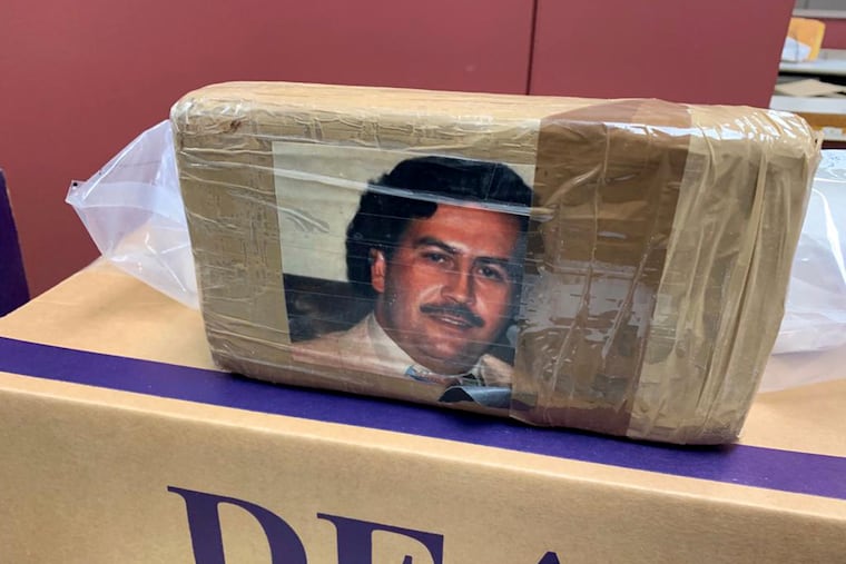 In this undated photo provided by the New York City office of the Drug Enforcement Administration, a confiscated package of drugs is labeled with a picture of Pablo Escobar.