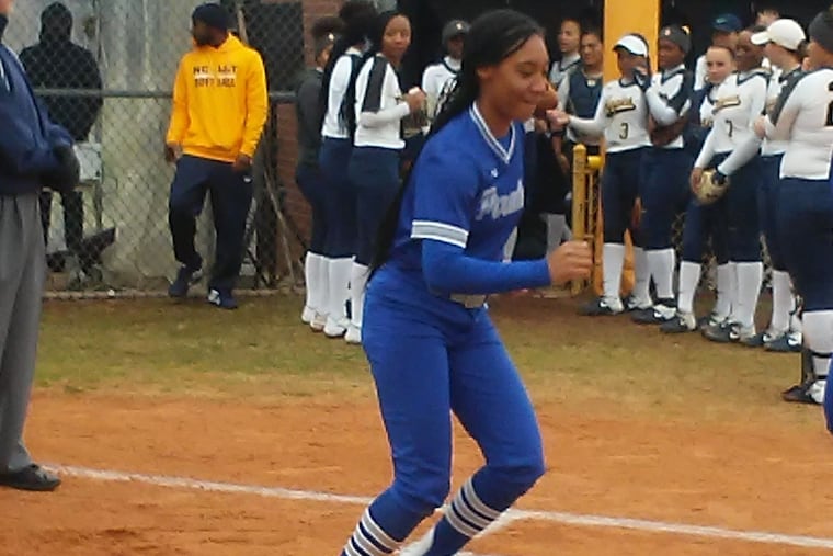 Mo'ne Davis warms up with her Hampton University teammates before Saturday's game.