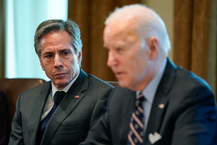 Secretary of State Antony Blinken listens as President Joe Biden speaks during a meeting at the White House on March 10.