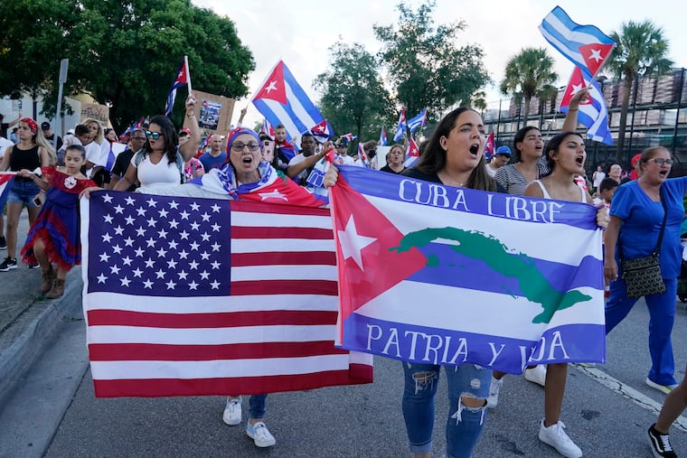 Demonstrators shout their solidarity with the Cuban people against the communist government in Hialeah, Fla., last week. Hialeah has the greatest concentration of Cuban exiles in the U.S.