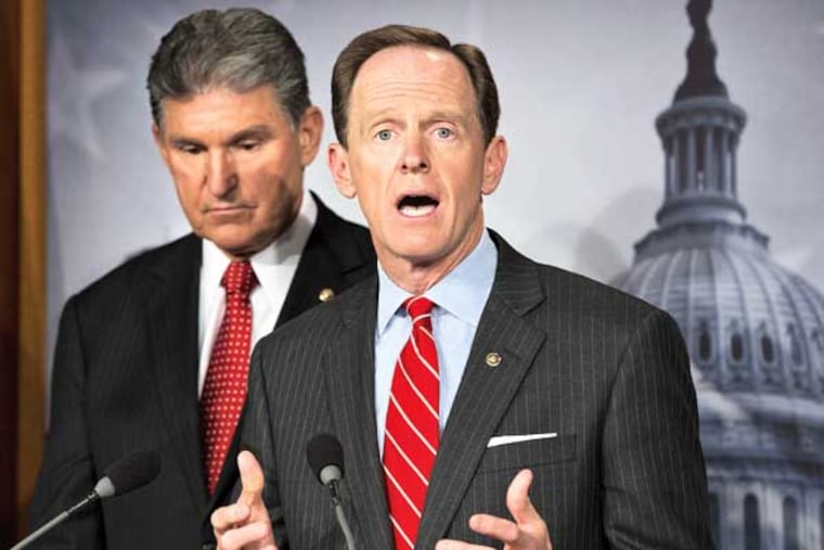 Sen. Joe Manchin, D-W.Va. listens at left, as Sen. Patrick Toomey, R-Pa. announce that they have reached a bipartisan deal on expanding background checks to more gun buyers, Wednesday, April 10, 2013, on Capitol Hill in Washington. (AP Photo/J. Scott Applewhite)