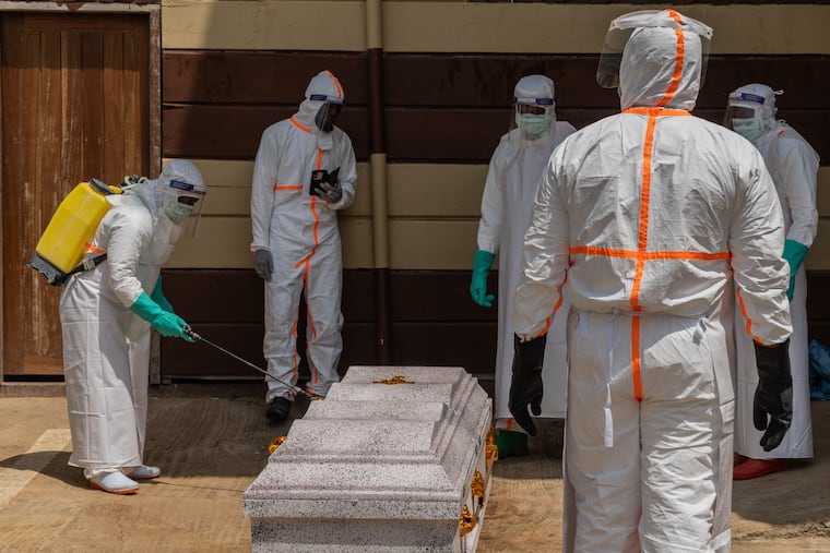 Health workers prepare the coffin of Angèle Muyumba Nsimire, a university student who died of Ebola at the Citadelle Clinic in Bunia, Congo, Friday, June 12, 2026.