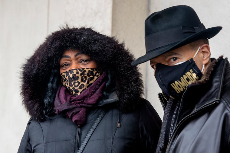 Yullio Robbins, the mother of 28-year-old James Walke III, with homicide Detective Gregory Santamala outside the Police Administration Building on Monday. She is marking the five-year anniversary of his shooting death.
