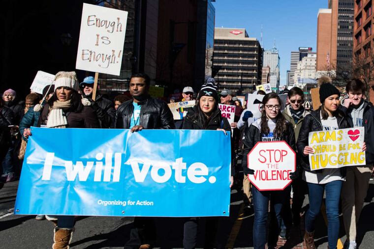 Hundreds of people make their way down Market Street during the March for Our Lives against gun violence last month.