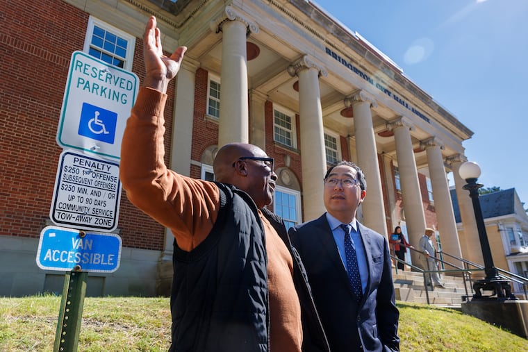 Sen. Andy Kim speaks with Dave Peterson, the Bridgeton director of public works, before touring housing developments in the South Jersey city on Friday. Kim spent the day visiting with various communities in Cumberland County.