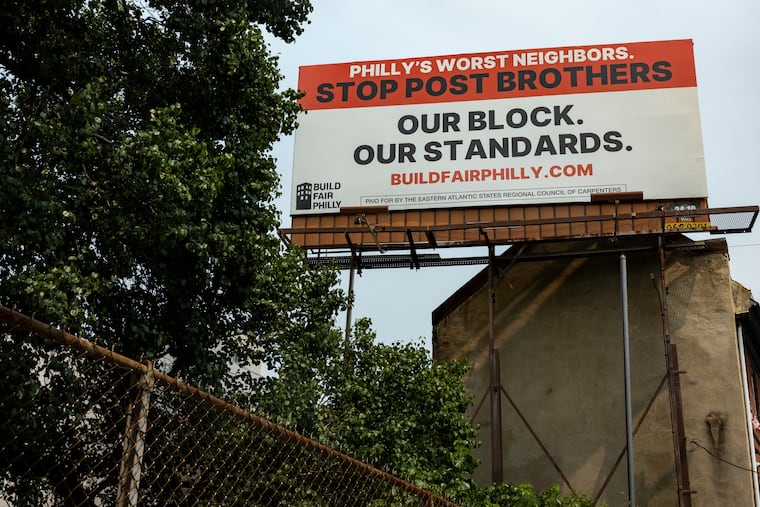 The Carpenters Union’s Build Fair Philly campaign billboard across from I-95 on Fairmount Avenue in July.