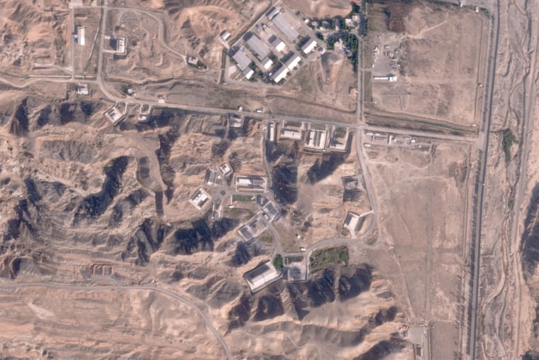 This satellite photo from Planet Labs PBC shows damaged buildings at Iran's Parchin military base outside of Tehran, Iran, Sunday. An Israeli attack on Iran damaged facilities at a secretive military base southeast of the Iranian capital that experts in the past have linked to Tehran's onetime nuclear weapons program and at another base tied to its ballistic missile program, satellite photos analyzed Sunday by The Associated Press show. The damaged structures are in the bottom right corner and bottom center of the image.