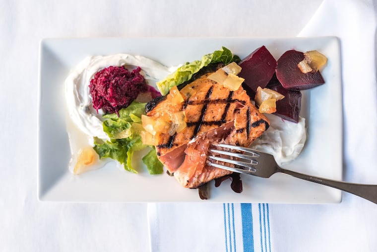 Cured meat, hearty whole-grain bread, pickled vegetables, and smoked fish — like the grilled gravlax pictured here, from Passyunk's Noord — are staples of Nordic cuisine.