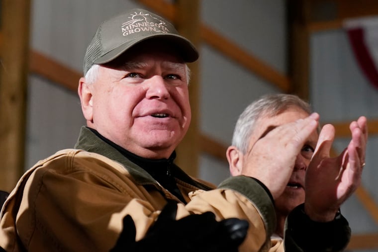 Minnesota Gov. Tim Walz applauds as President Joe Biden speaks in Northfield, Minn., Nov. 1, 2023. Walz will make his debut Tuesday in Philadelphia as Vice President Kamala Harris' running mate.