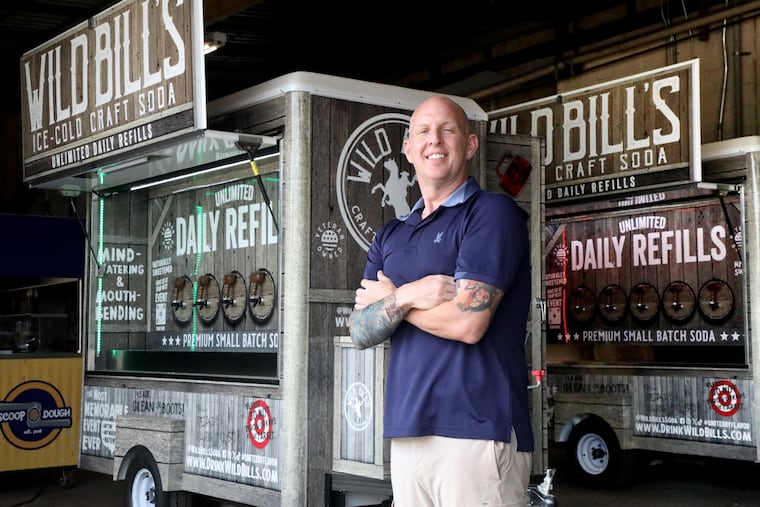 David Kyle, vice president of Custom Mobile Food Equipment, in Hammonton, stands near a recently completed food cart for Wild Bill's Craft Beverage Co., which used Custom Mobile Food Equipment carts to serve customers at 600 events across the U.S. last year.