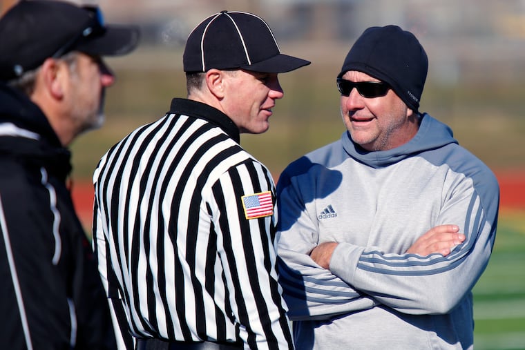 Phil Gormley (right), the acting athletic director and former football coach at Northeast High School, is worried that the 2020 fall season may not get underway at all due to logistical challenges.