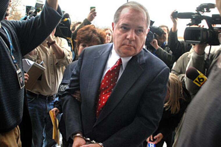 Former House Speaker John Perzel is brought in handcuffs to Magisterial District Justice office in Harrisburg today, the day after state prosecutors charged him with 82 criminal counts. ( Tom Gralish / Staff Photographer )