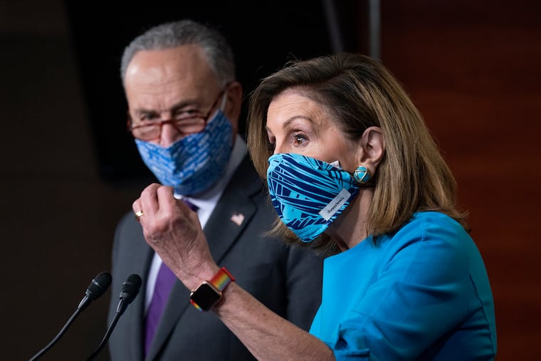 Speaker of the House Nancy Pelosi and Senate Minority Leader Chuck Schumer (left) meet with reporters Thursday on Capitol Hill.