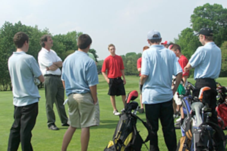 Burns, second from left, instructs his team and the Lenape High golf squad before players tee off at a recent match at Ramblewood Golf Course in Mount Laurel.