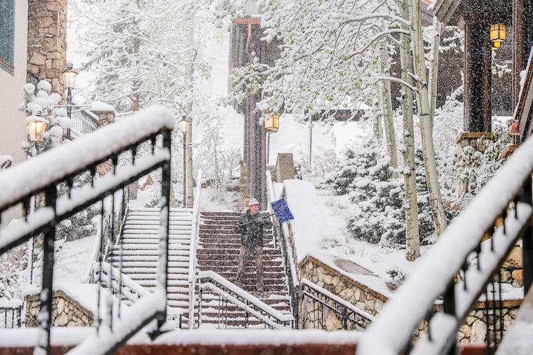 Chris Osborne shovels snow Wednesday in Beaver Creek, Colo.