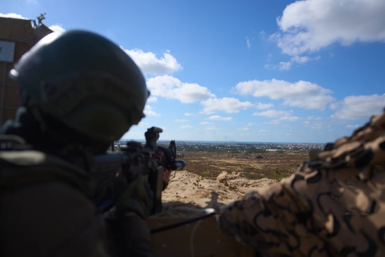 An Israeli soldier occupies a military position overlooking the so-called yellow line in the central Gaza Strip on Tuesday.