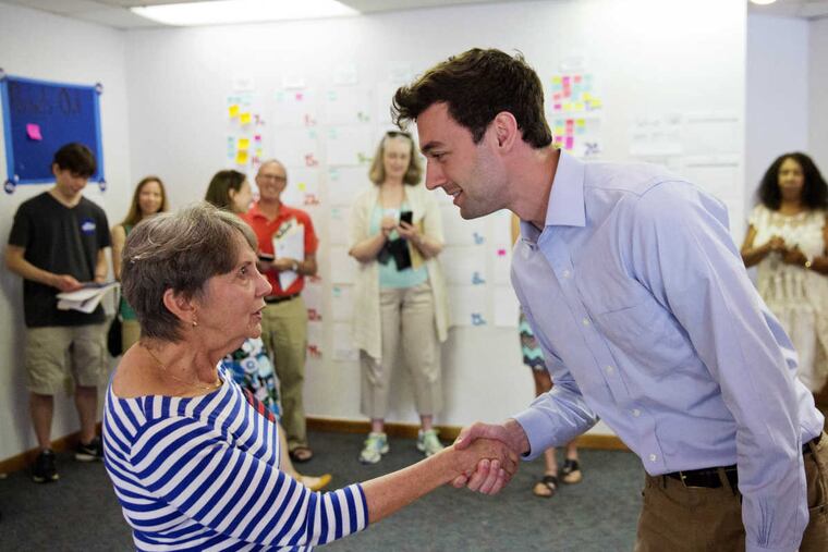 Volunteer Harriet Zoller greets Jon Ossoff, a 30-year-old Democrat running for Congress in Georgia’s traditionally conservative Sixth Congressional District.