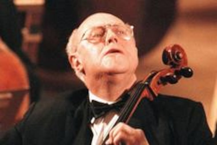 Mstislav Rostropovich plays at a 1998 memorial in Moscow for his friend Alexander Solzhenitsyn.