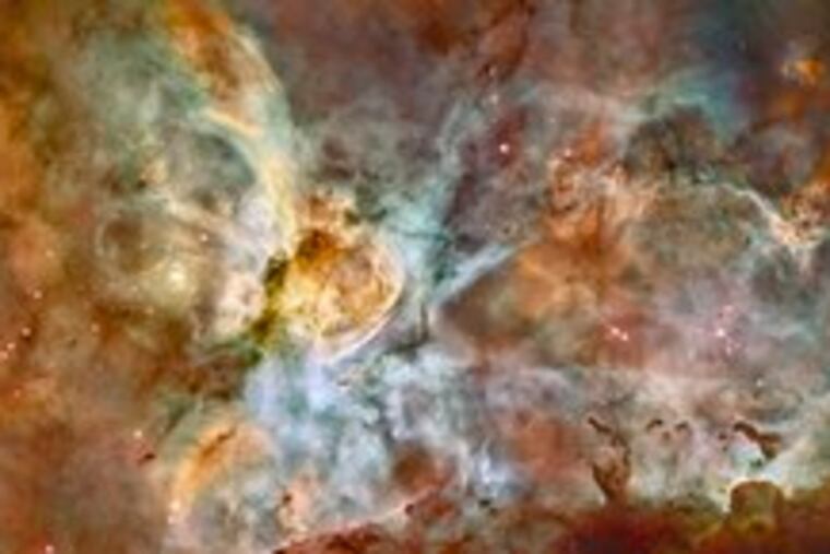A 50-light-year-wide view of the Carina Nebula from Hubble Space Telescope cameras shows the process of star birth at a new level of detail. The bizarre landscape of the nebula is sculpted by the action of outflowing winds and scorching ultraviolet radiation from the monster stars that inhabit this inferno. These stars are shredding the surrounding material that is the last vestige of the giant cloud from which the stars were born. This immense nebula contains a dozen or more brilliant stars that are estimated to be at least 50 to 100 times the mass of our sun. The fireworks in the region started three million years ago.