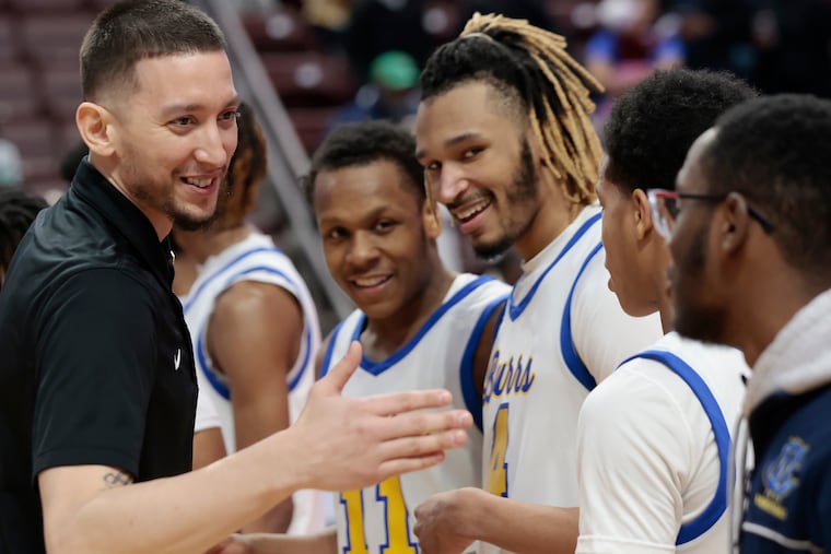 West Catholic head coach Miguel Bocachica congratulates each player individually after winning the PIAA Class 3A final at the Giant Center in Hershey on March 25.