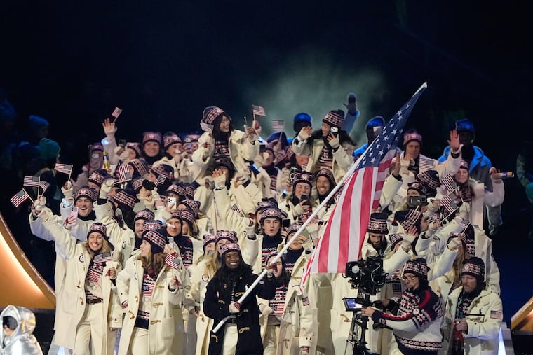 Erin Jackson, flag bearer of United States, leads American athletes as they walk during the Olympic opening ceremony at the 2026 Winter Olympics, in Milan, Italy, Friday, Feb. 6, 2026. (AP Photo/Lee Jin-man)