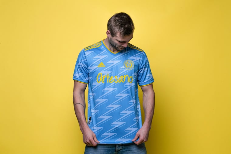 Union forward Kacper Przybylko models the team's new jersey for the 2021 season.