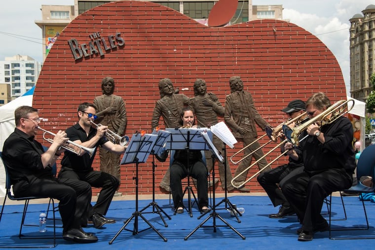 Philadelphia Orchestra musicians perform Friday In Beatles Square in the Mongolian capital of Ulaanbaatar. (L to r): Principal Trumpet David Bilger, trumpet player Anthony Prisk, Principal Horn Jennifer Montone, Co-Principal Trombone Matthew Vaughn, and bass trombonist Blair Bollinger. PHOTO: Jan Regan /The Philadelphia Orchestra