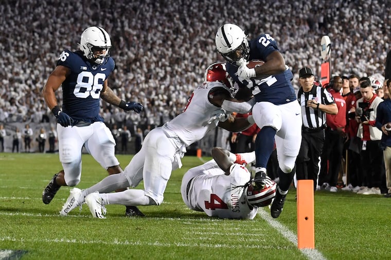 Penn State running back Keyvone Lee is tackled by Indiana linebacker Cam Jones (4) in the first half Saturday night.