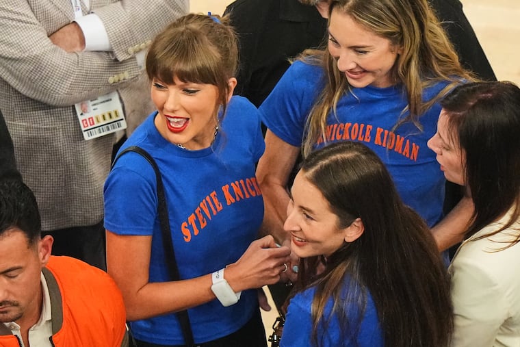 Taylor Swift, with Este Haim (center right back) and Alana Haim (center right front) arrives at Madison Square Garden before Game 4 of the NBA Finals.
