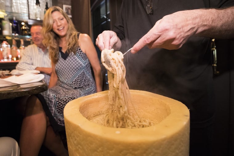 Freshly prepared pasta is gently tossed into a wheel of Pecorino to make cacio e pepe at Cafe 2825 in Atlantic City. Cafe 2825 has been faced with the restaurant reservation scalping industry, which could soon be banned.