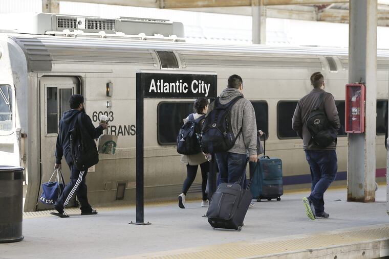 Passengers board an Atlantic City Rail Line train before the shutdown earlier this year.