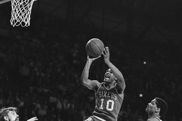 Philadelphia’s Maurice Cheeks (10) puts up a shot as Milwaukee’s Marques Johnson, right, watches during NBA playoff action, Friday, May 8, 1982, Milwaukee, Wisc. Cheeks lead the 76ers with 26 points as they defeated the Bucks 120-90. Philadelphia won the best of seven series four games to two and advances to meet Boston.