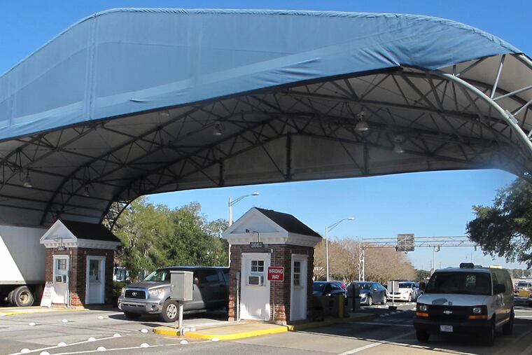 This 2016 photo shows the entrance to the Naval Air Base Station in Pensacola, Fla.