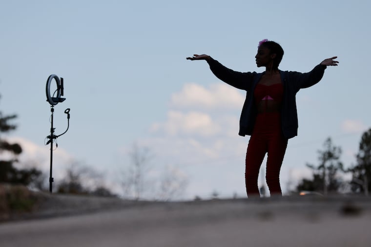 Dancing by herself, 21 year old Tamarah Overton of Philadelphia enjoys the weather in April. It has been April-like this weekend around here.