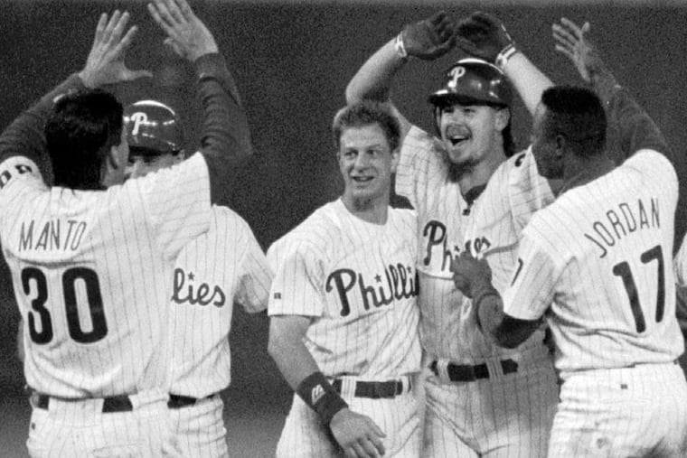 Phillies closing pitcher Mitch Williams (second from right) celebrates his 10th-inning, game-winning RBI with teammates after defeating the Padres in the second half of a rain-delayed doubleheader on the morning of July 3, 1993.