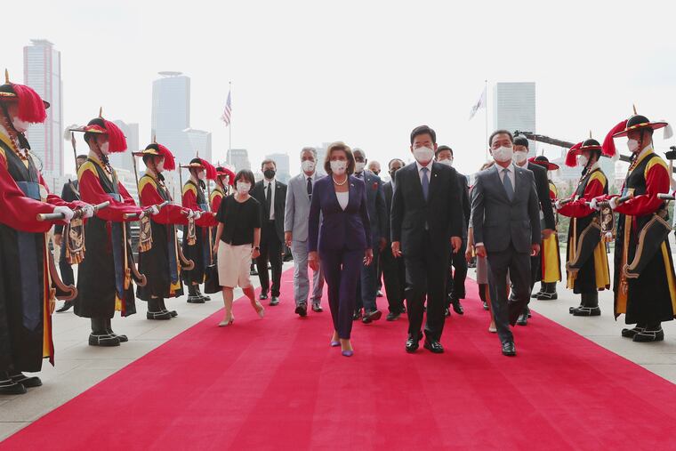U.S. House Speaker Nancy Pelosi (center left) and South Korean National Assembly Speaker Kim Jin Pyo (center right) inspect an honor guard upon her arrival at the National Assembly in Seoul on Thursday.