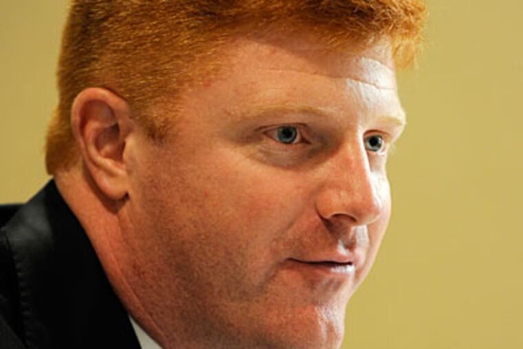 Penn State quarterbacks coach Mike McQueary, who has faced harsh criticism over what he did after he saw Jerry Sandusky allegedly raping a boy in the PSU locker room.