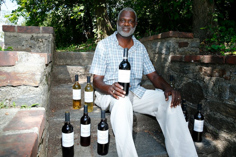 Founder, CEO & Managing Partner of Mitchell & Mitchell Wines, Frank Mitchell with bottles of his wine in the Overbrook neighborhood of Philadelphia on Monday, July 27, 2020. Mitchell & Mitchell Wines in one of Philadelphia's only Black-owned wine businesses.