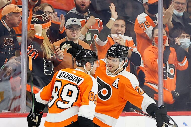 Flyers center Scott Laughton, right, ranks fourth on the team with 23 points this season.