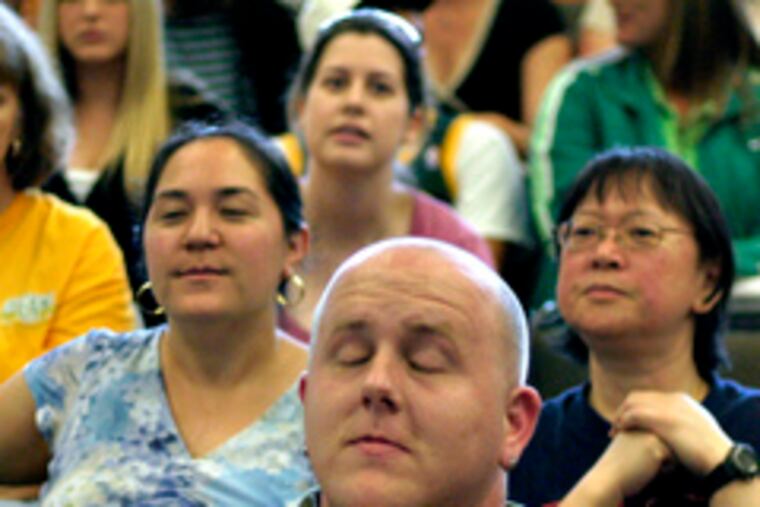 Seattle fan Kenny Burns prays that the SuperSonics make the right pick in the draft.