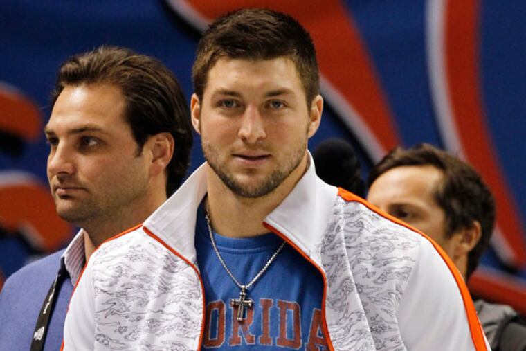 Tim Tebow walks the sidelines prior to the start of the Sugar Bowl NCAA college football game between Florida and Louisville on Wednesday, Jan. 2, 2013, in New Orleans. (Butch Dill/AP)