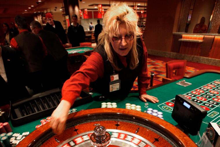 Laureen Jolley spins the roulette wheel in the new Parx East Casino in the old Philly Park building on opening day, December 22. 2010. (Laurence Kesterson / Staff Photographer) EDITORS NOTE: PARX23, 12/22/10, Bensalem, Pa. The second half of Parx Casino - Parx East - officially opens today (WED -12/22) at 10am with new live table games such as pai-gow, pai-gow tiles, mini-baccarat, geared toward the Asian clientele, as well as 3 card poker, 4 card poker, blackjack, roulette and craps tables. A new dining outlet - The Noodle Bar - also debuts today. This latest expansion adds to last month's launch of a new poker room on the third floor and has created approximately 400 new jobs at the state's top grossing casino.
