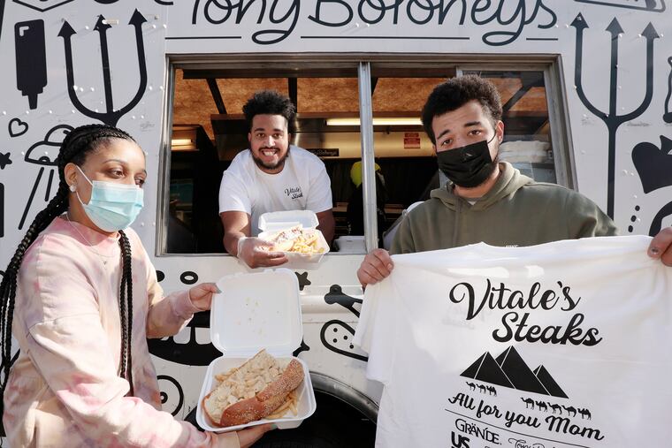 Dustin Vitale (center) with siblings Jessica Thomas and Denny Vitale at the Tony Boloney food truck in Northeast Philadelphia.