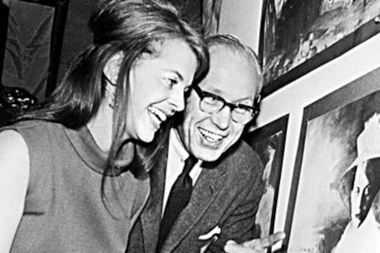 DM1kaki08. Photo from Philadelphia Museum of Art files. Kaki is shown at left, inspecting some art with an unidentified man at right. Mid 1960s.