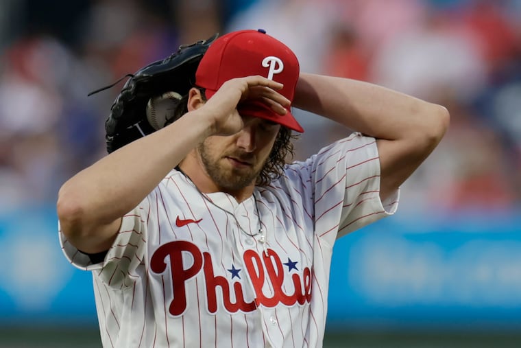 Phillies pitcher Aaron Nola envisions how to get out of the fifth inning he was in against the Los Angeles Dodgers at Citizens Bank Park on Wednesday.