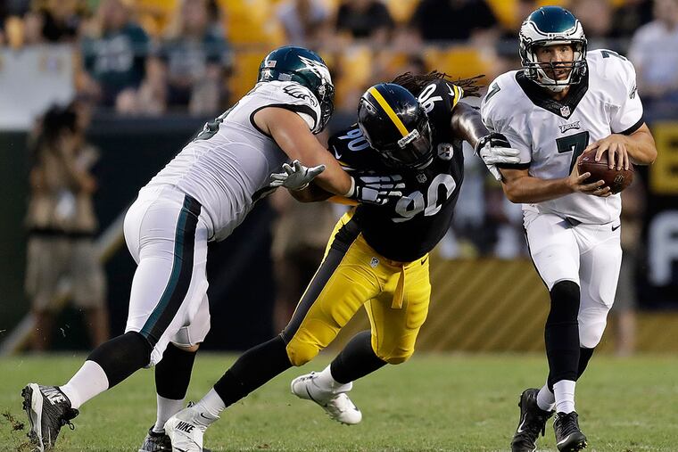 Isaac Seumalo tries to keep the Steelers' Ricardo Matthews off Sam Bradford last Thursday.