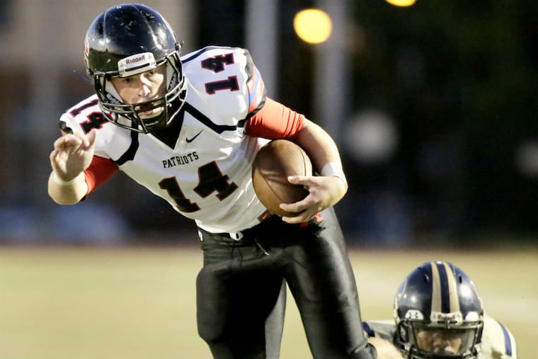 Germantown Academy's # 14 James McAfee has his eye on the prize and will run into the end zone scoring a touchdown with 2:42 to go in the second quarter of the Germantown Academy at Prep Charter H.S. football game on Sept. 11,
2015.